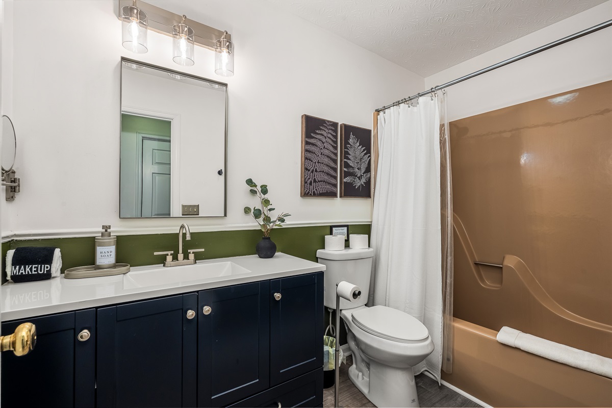 Clean, bright, and fully stocked — a comfy bathroom with everything your family needs.