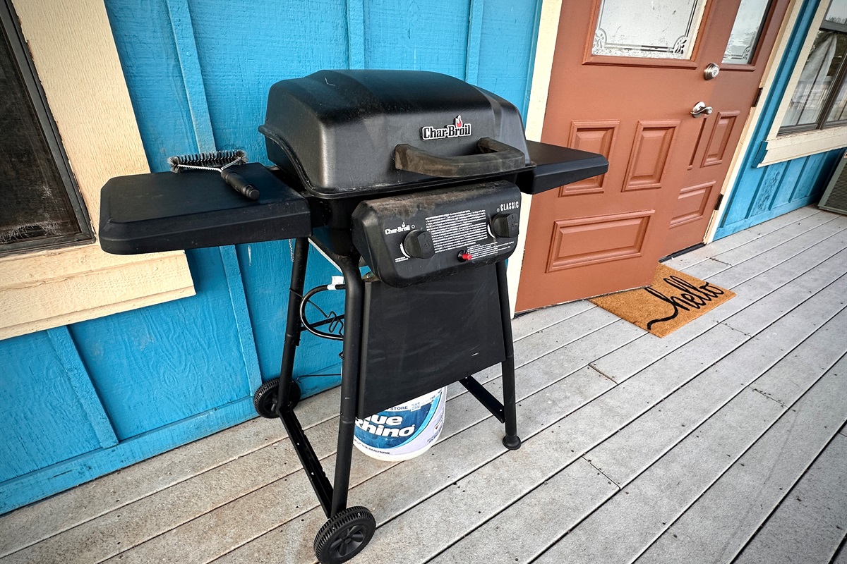 Propane grill located by the back door
