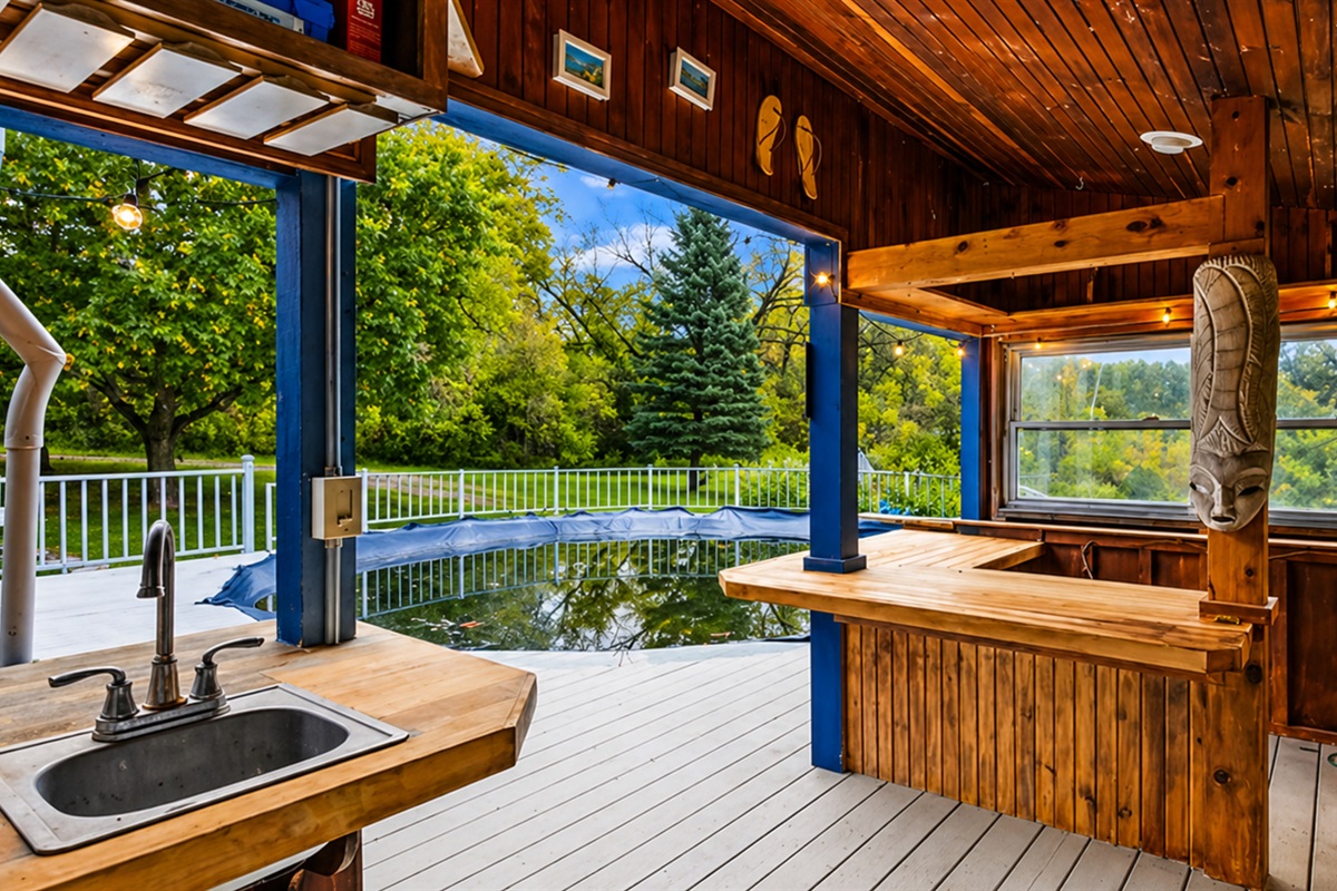 Spacious outdoor area equipped with a convenient sink for outdoor activities, picnics, and BBQ gatherings.