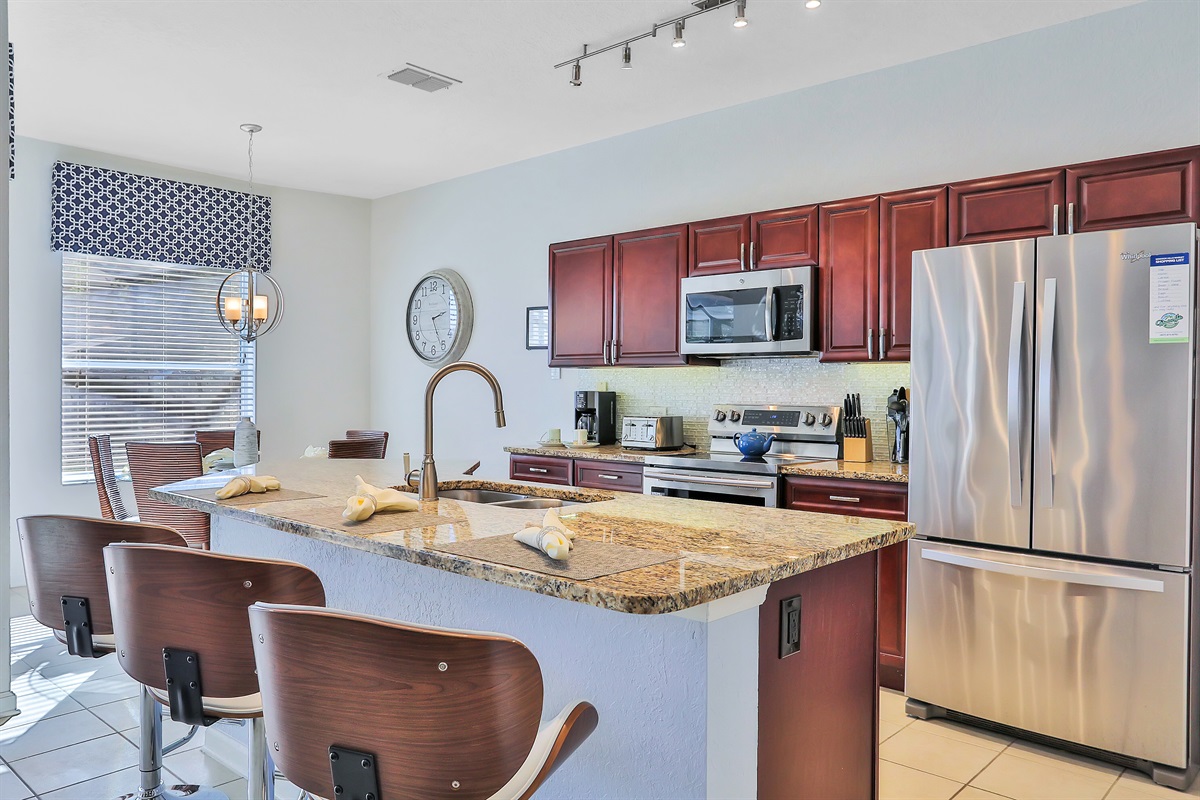 Well equipped granite kitchen