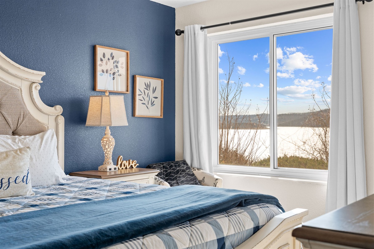 Bright king bedroom with natural light.