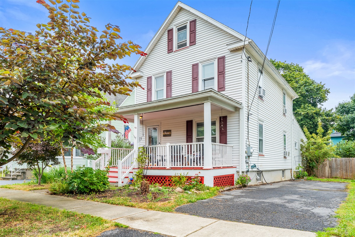 Charming colonial with classic curb appeal, covered front porch, and off-street parking—perfect for relaxing mornings and evenings!