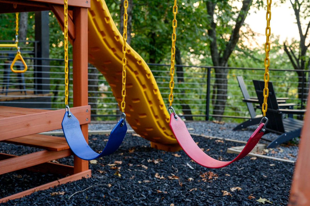 On-site playground with swings and a slide.