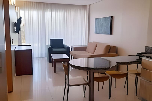 A spacious and bright living area perfect for relaxation or enjoying a meal.