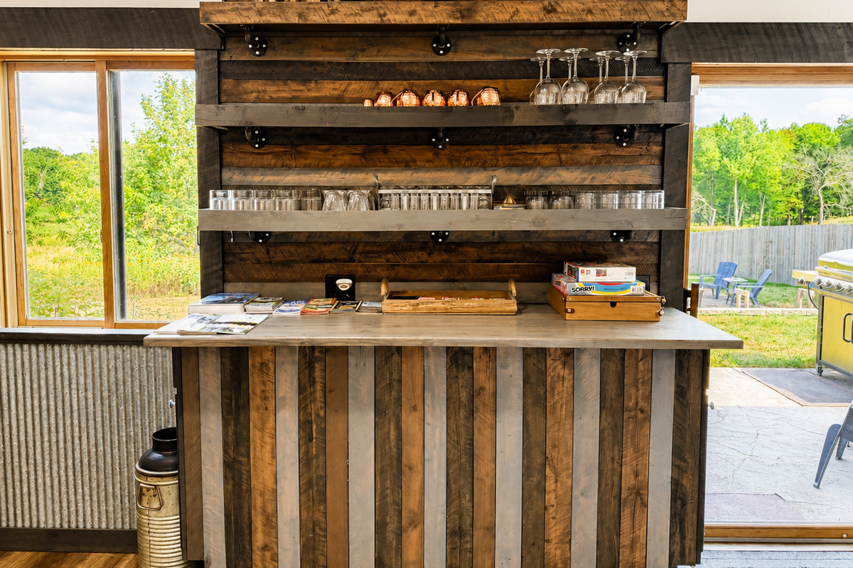 Rustic indoor bar and gathering area adds another fun place to relax, enjoy drinks, play games, and reconnect with your group after a full day on the nearby ATV and snowmobile trails.