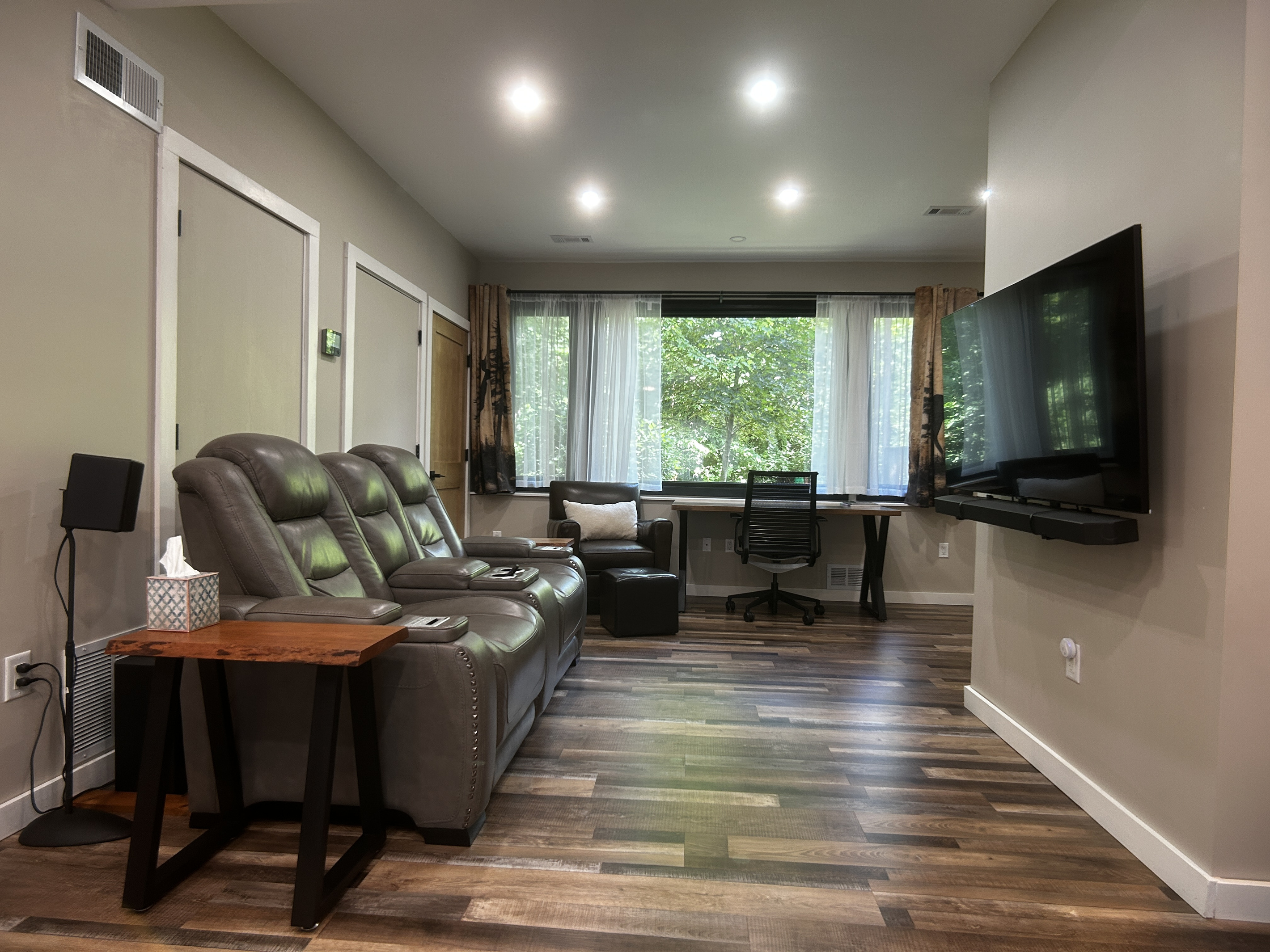 Stream your own shows through the Roku on the TV. TV mount allows TV to extend and swivel for multiple viewing options. Enjoy surround sound experience from reclining loveseat.
