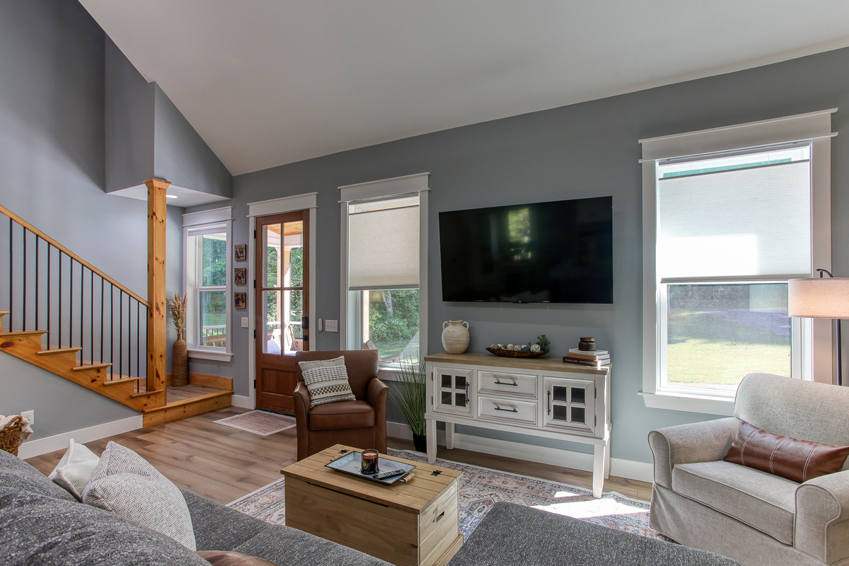 Enjoy a relaxed movie night at Robbin’s Nest on Snowbird Creek, with a large smart TV and comfortable seating for your group.