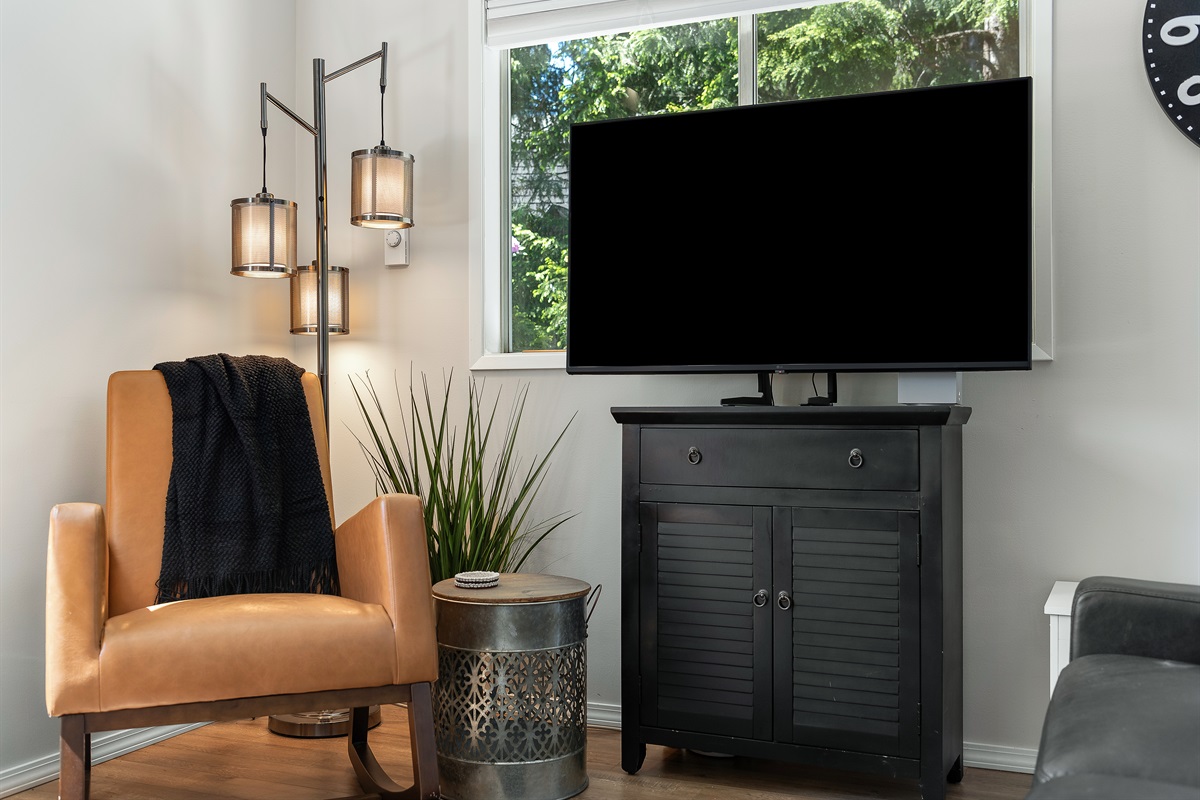 Living room on the main level with television. 