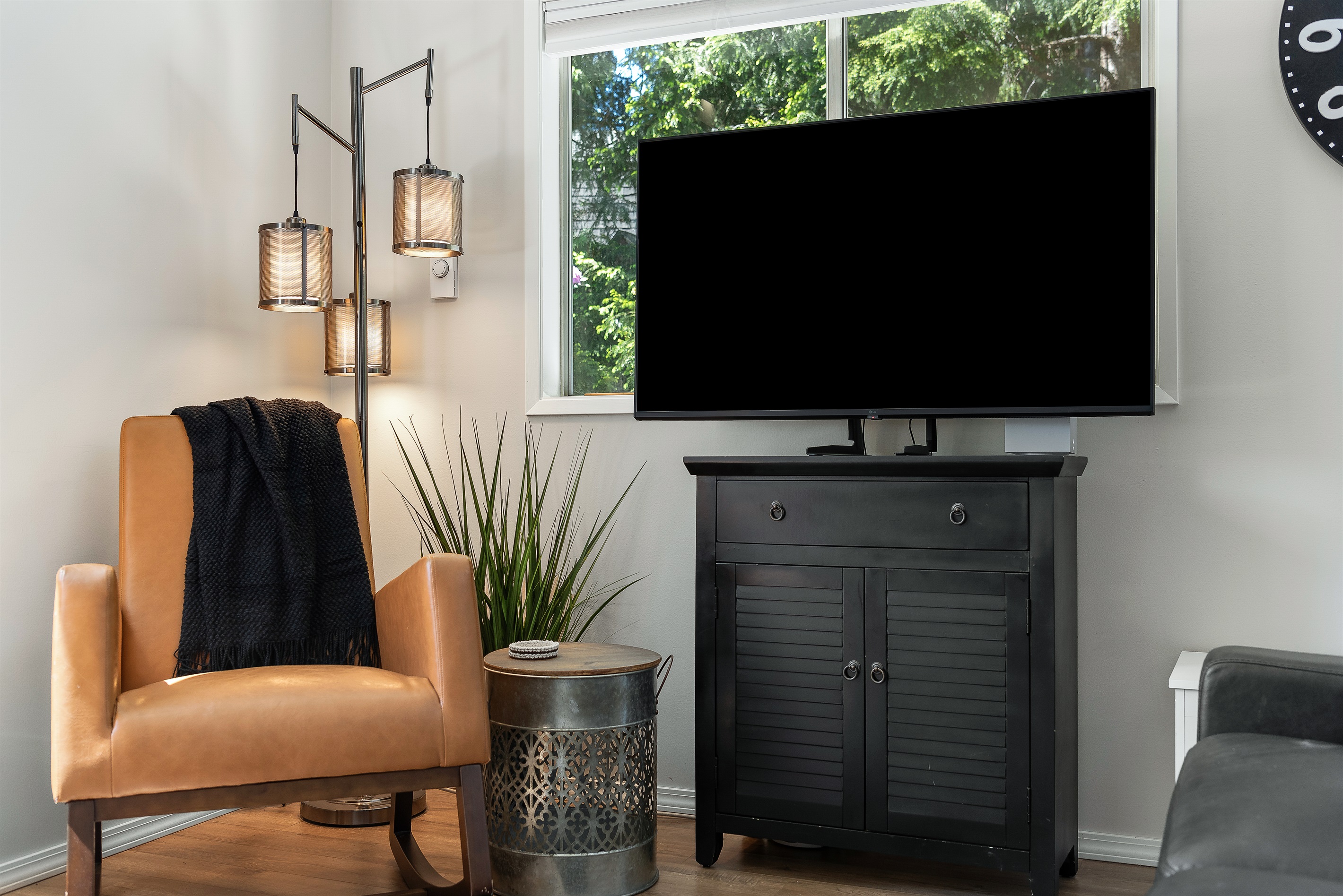 Living room on the main level with television. 