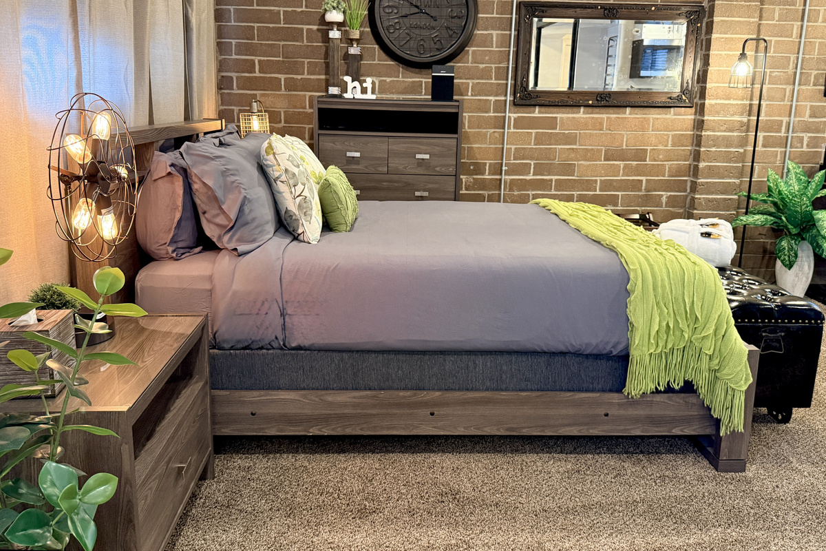 Open bedroom to enjoy the full ambiance of the space. Includes Edison-bulb fan lamp and unique industrial clock on the wall.