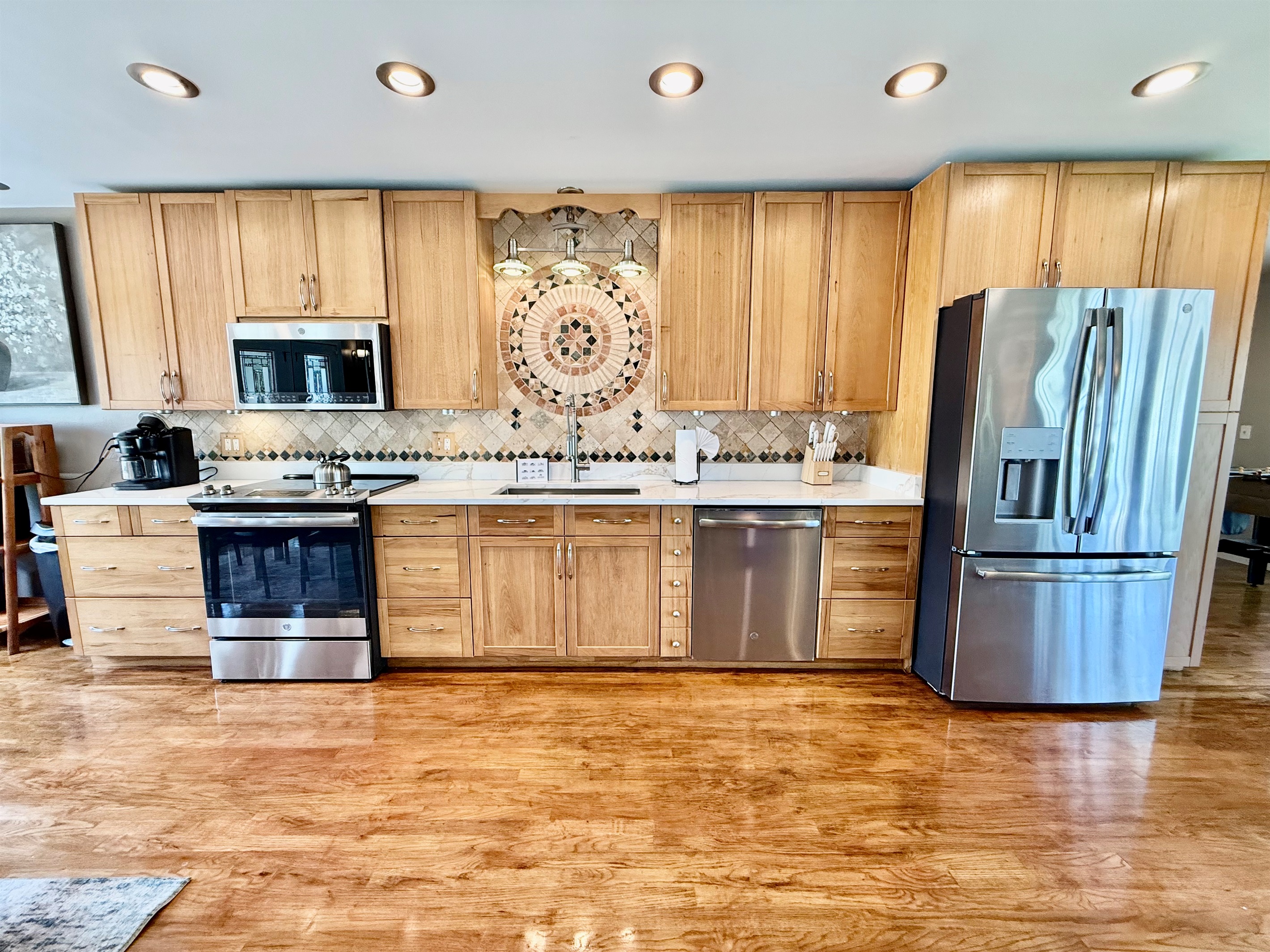Whether you're prepping snacks for the beach or cooking a family meal, this updated kitchen offers space, storage, and top-notch appliances to make it effortless.