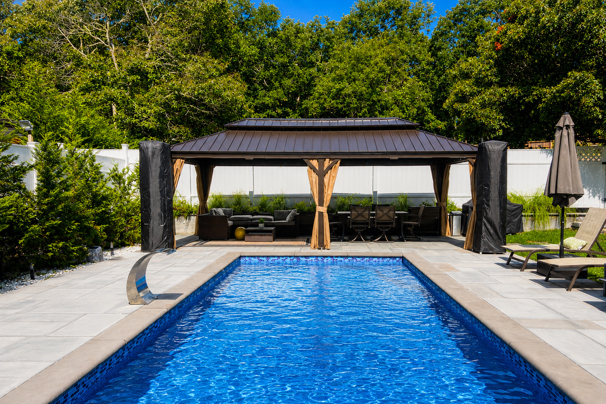 Sparkling heated pool framed by the shaded gazebo seating area
