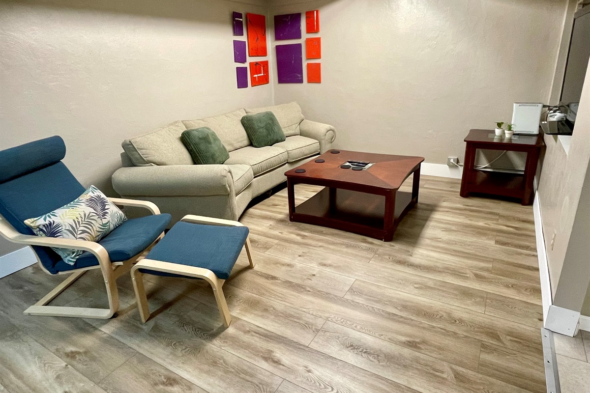 Lower level tv room with Xbox 360 and games