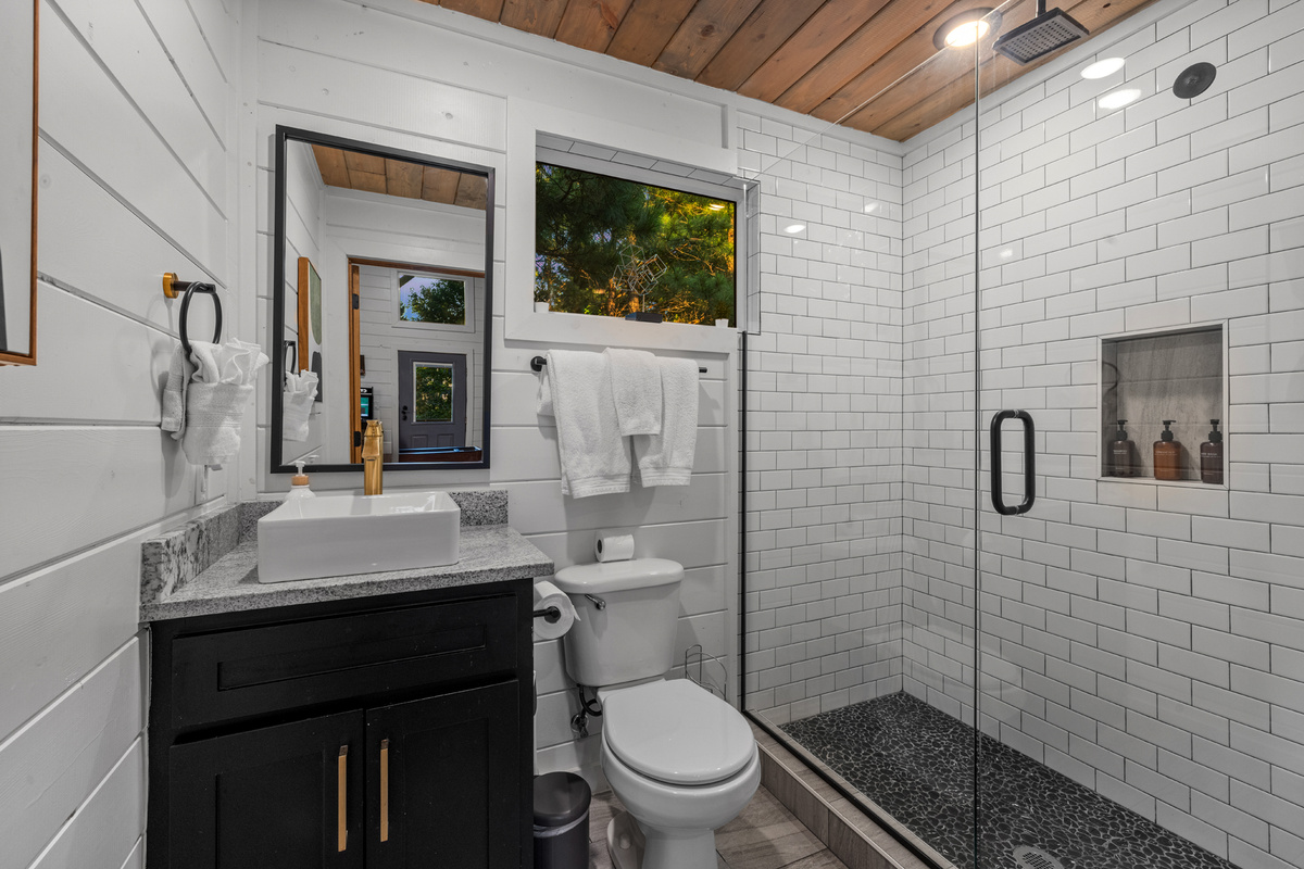 A clean and functional upstairs bathroom featuring a walk in shower, designed for everyday comfort and convenience during your stay. ✨