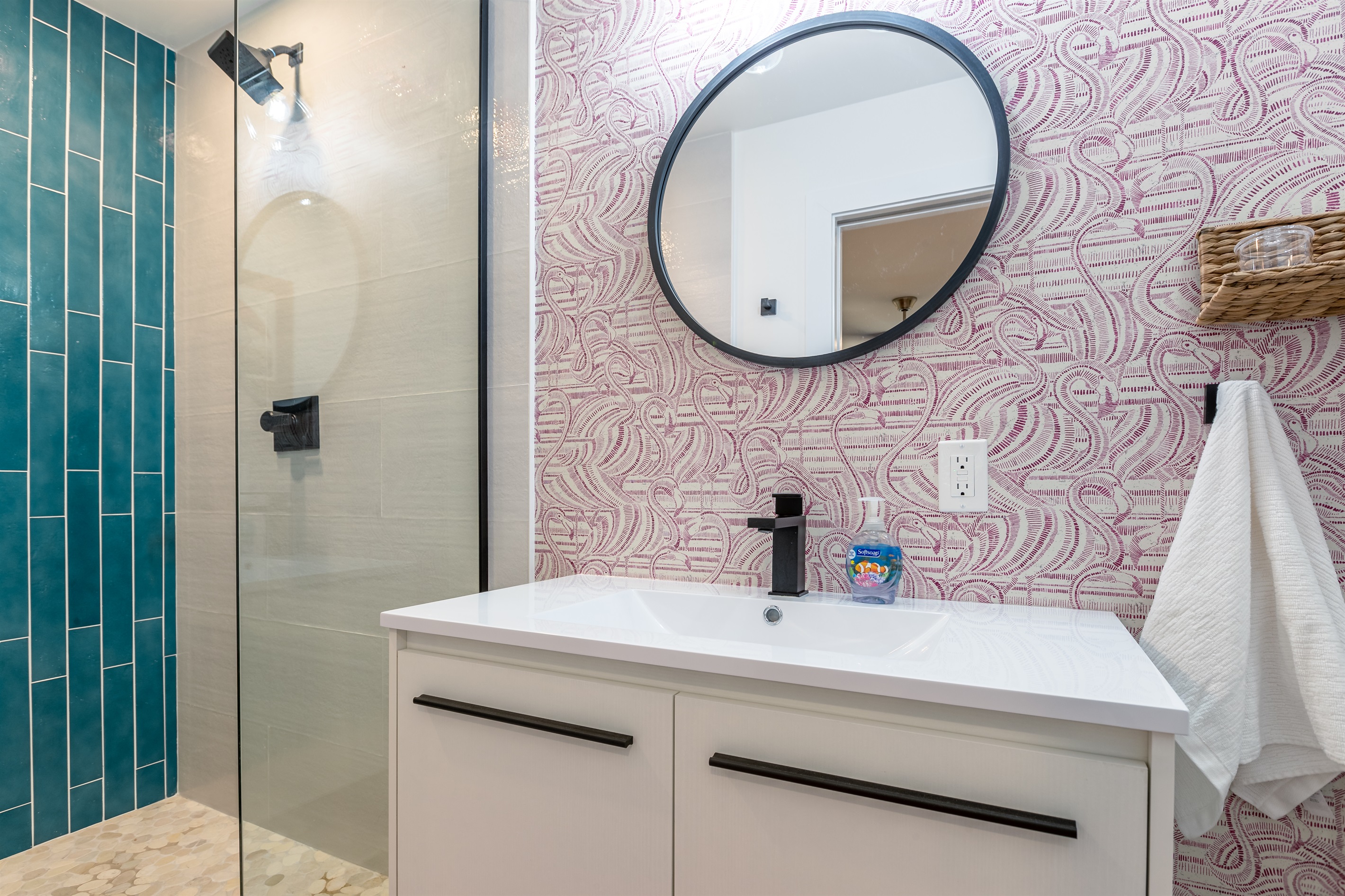 Bathroom Oasis: Vibrant tiles and modern fixtures create a refreshing retreat!