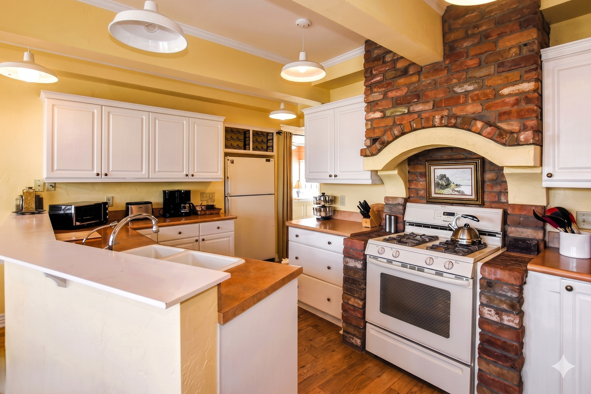 Cooking is a breeze in this fully equipped kitchen, featuring modern appliances and ample counter space.