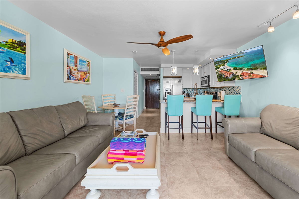 Queen sleeper sofa in the living room comfortably fits two adults.