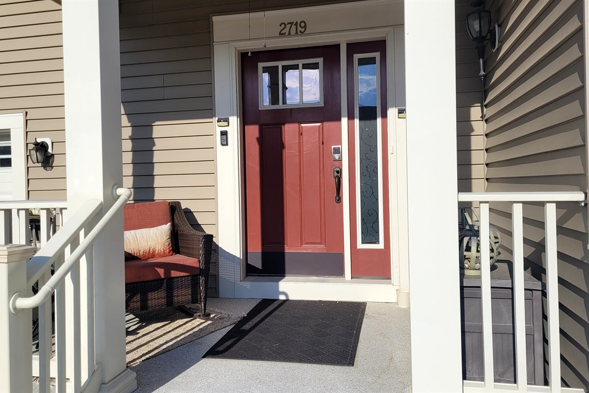 The front door is secured by a Schlage electronic lock and a Ring doorbell camera