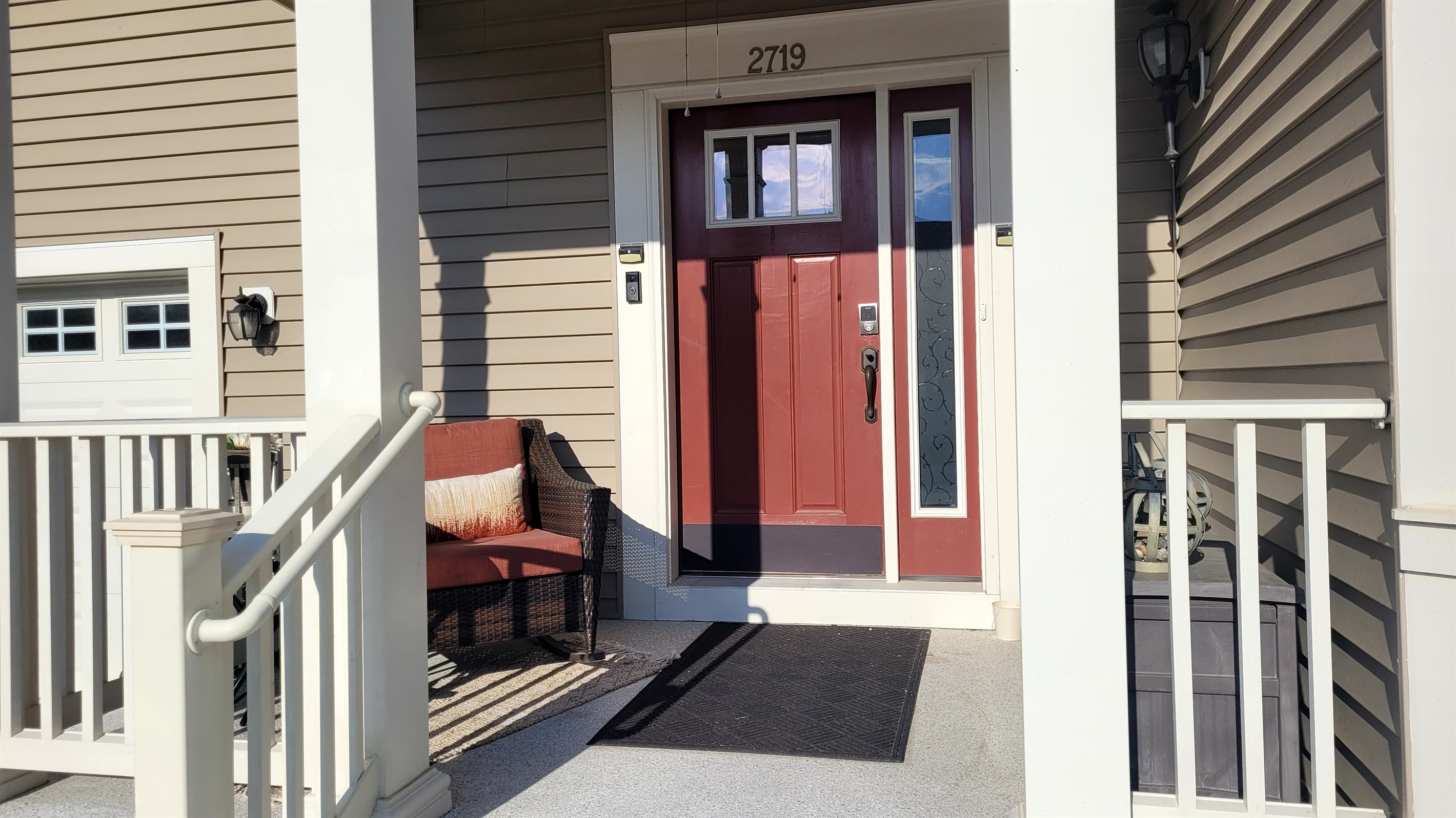 The front door is secured by a Schlage electronic lock and a Ring doorbell camera