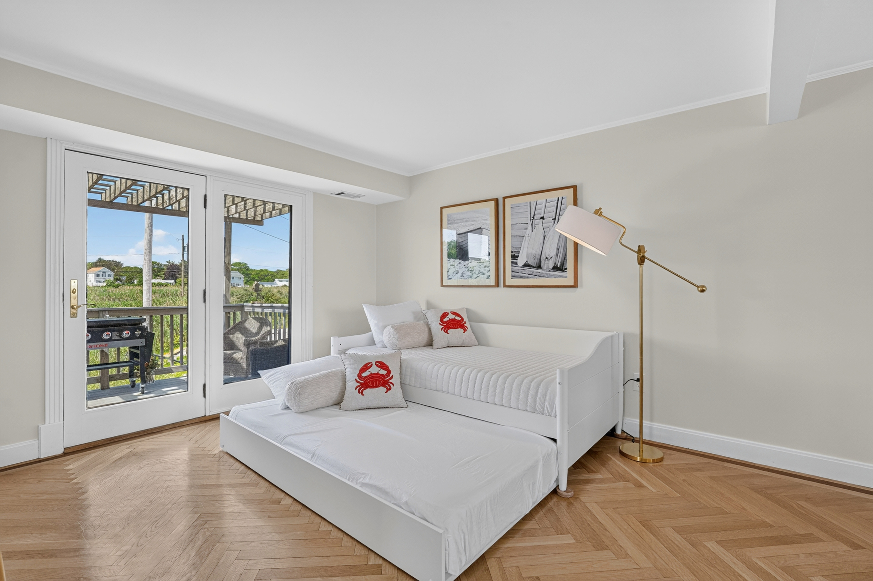 A peaceful, light-filled bedroom designed for comfortable nights and easygoing beach days.