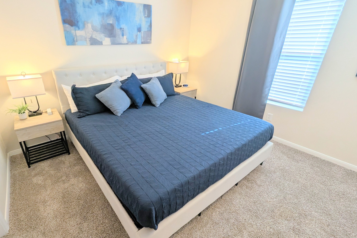 Sleep well in this comfortable space with King bed, ceiling fan, blackout curtains, and plush bedding. 