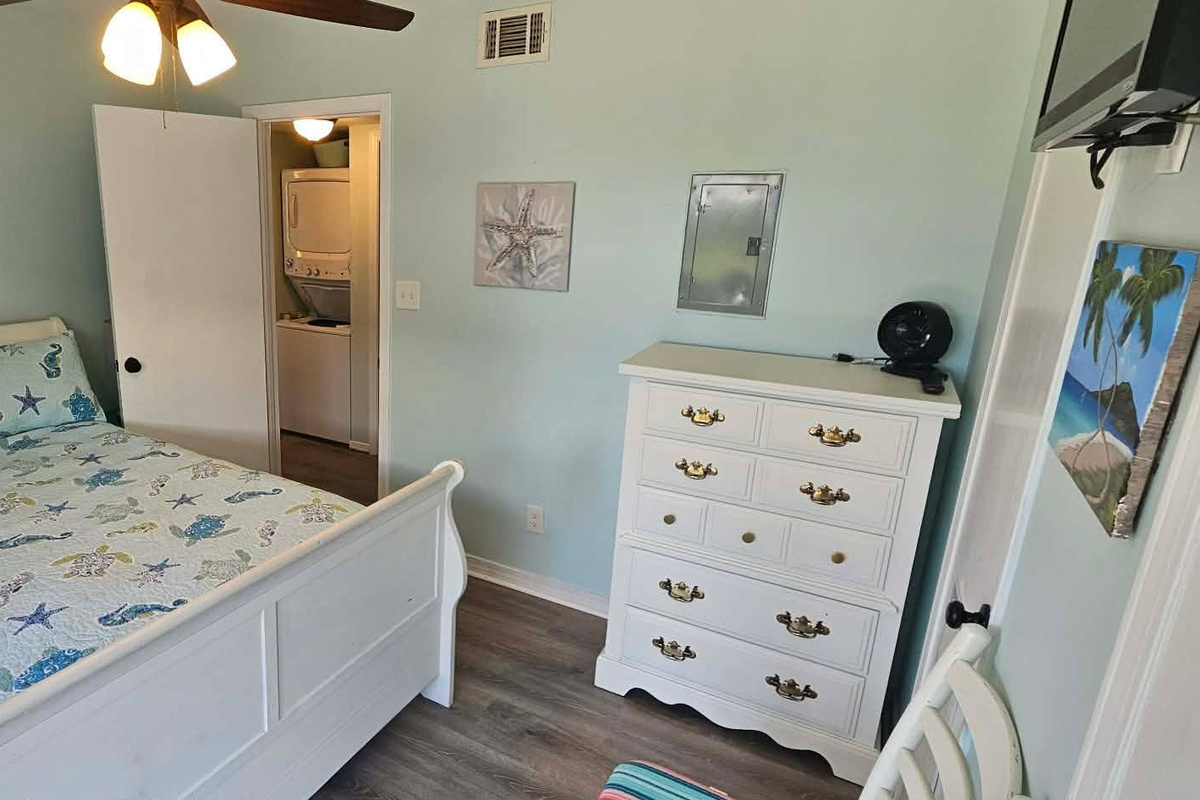 Bedroom 2. Queen size bed with dresser and closet
