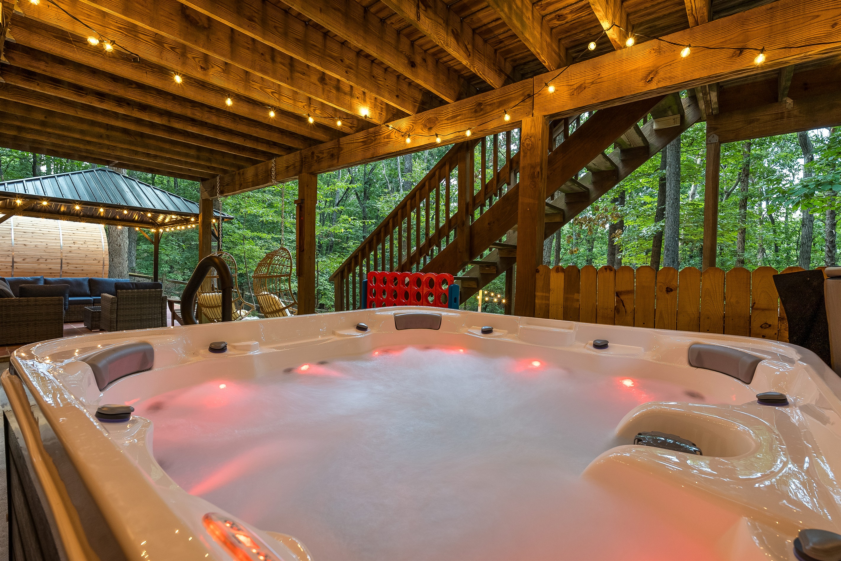 Evenings made better—soak under the string lights in our bubbling hot tub after a day of adventure
