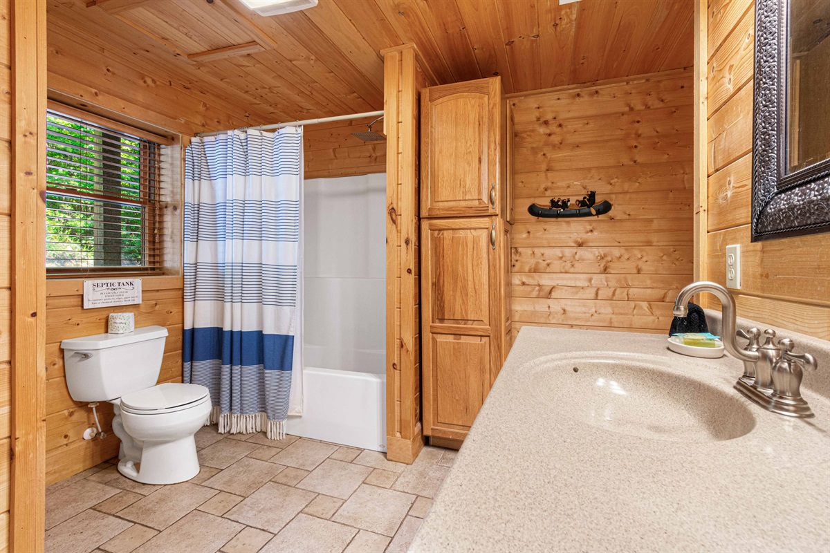 Downstairs Bathroom: Bright, natural light meets rustic charm in this inviting space designed for comfort!