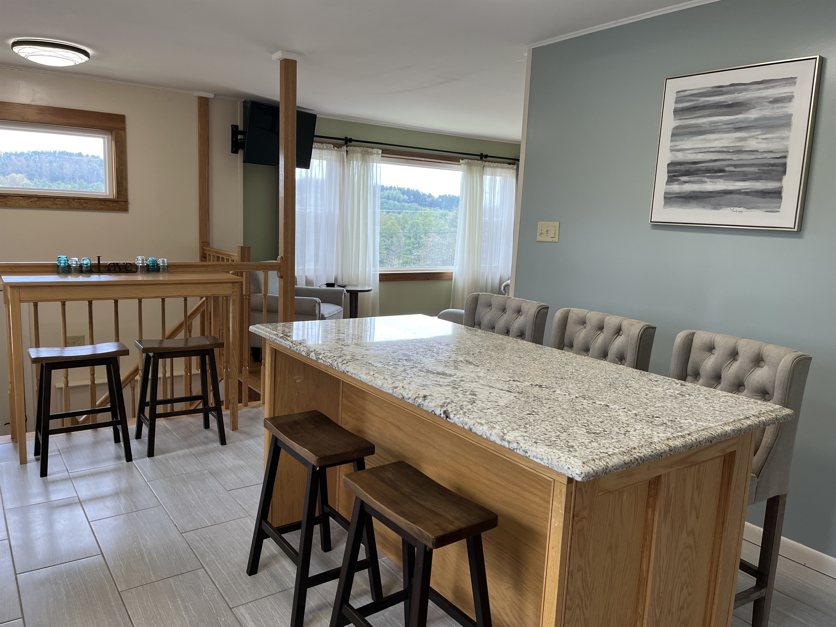 Granite countertop on the island, great for prep or eat-in kitchen.