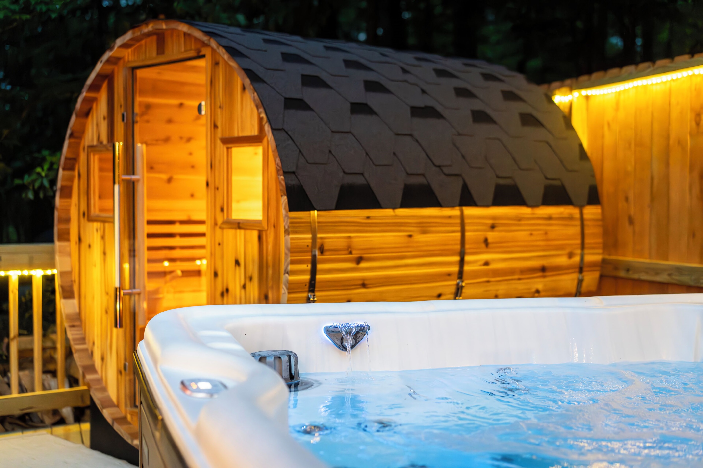 Deck with hot tub, sauna, and propane firetable / seating area
