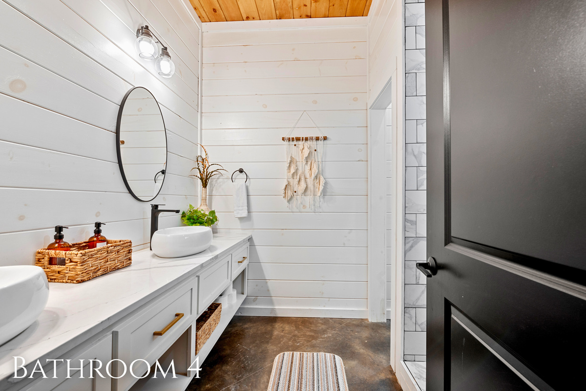 Bathroom bliss! Indulge in some 'me time' in this serene space that balances modern design with homey warmth.