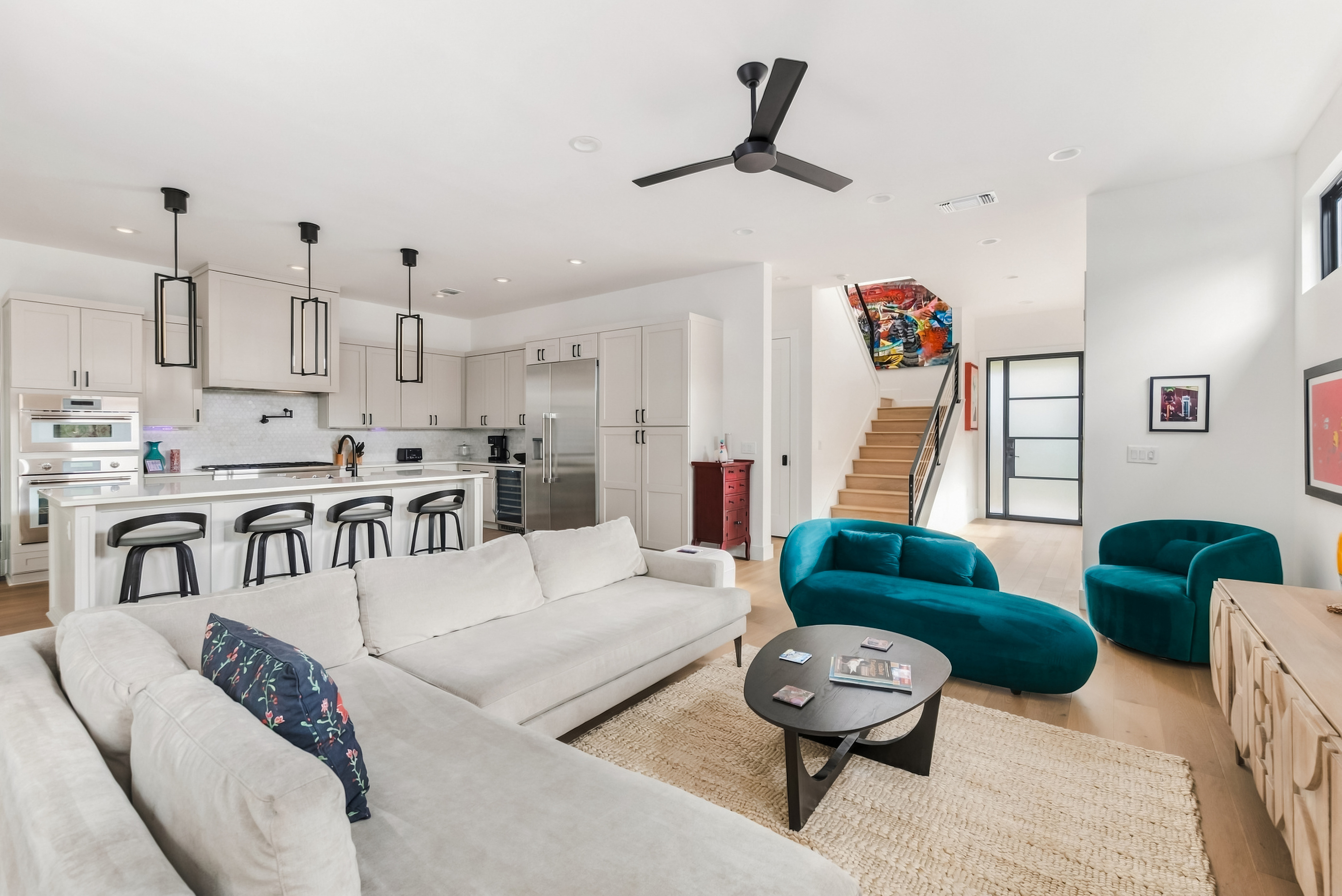 Living room opens straight into the kitchen and dining area — great for groups.