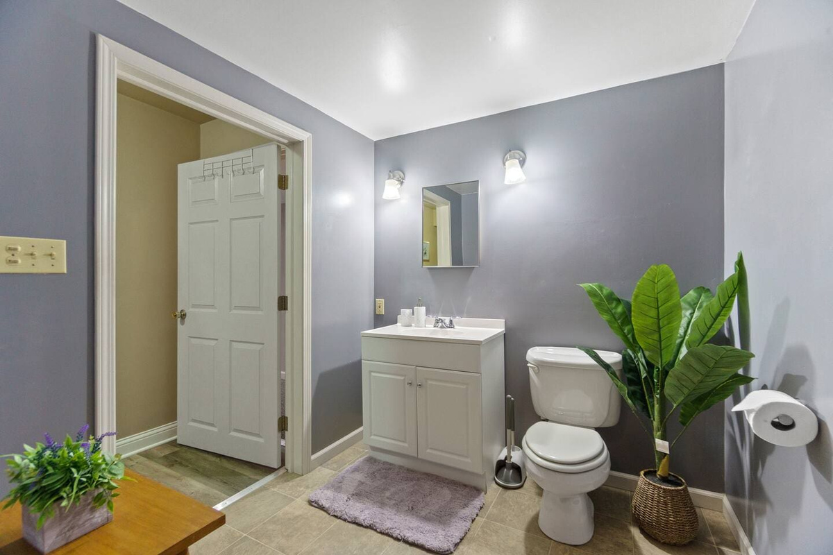 Full bathroom with modern fixtures, including a shower, bathtub, and all the essentials for a comfortable and convenient stay.