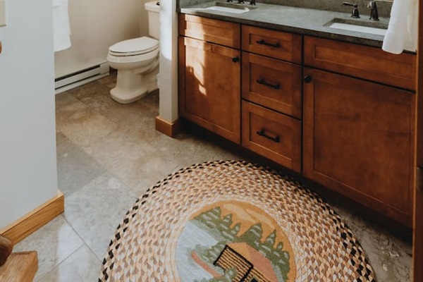 Bathroom 2 is on the upper level and is shared by Bedrooms 2 and 4