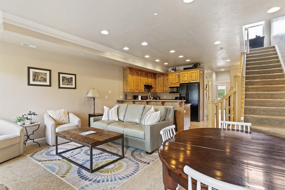 Open-concept living area with seating and dining space.