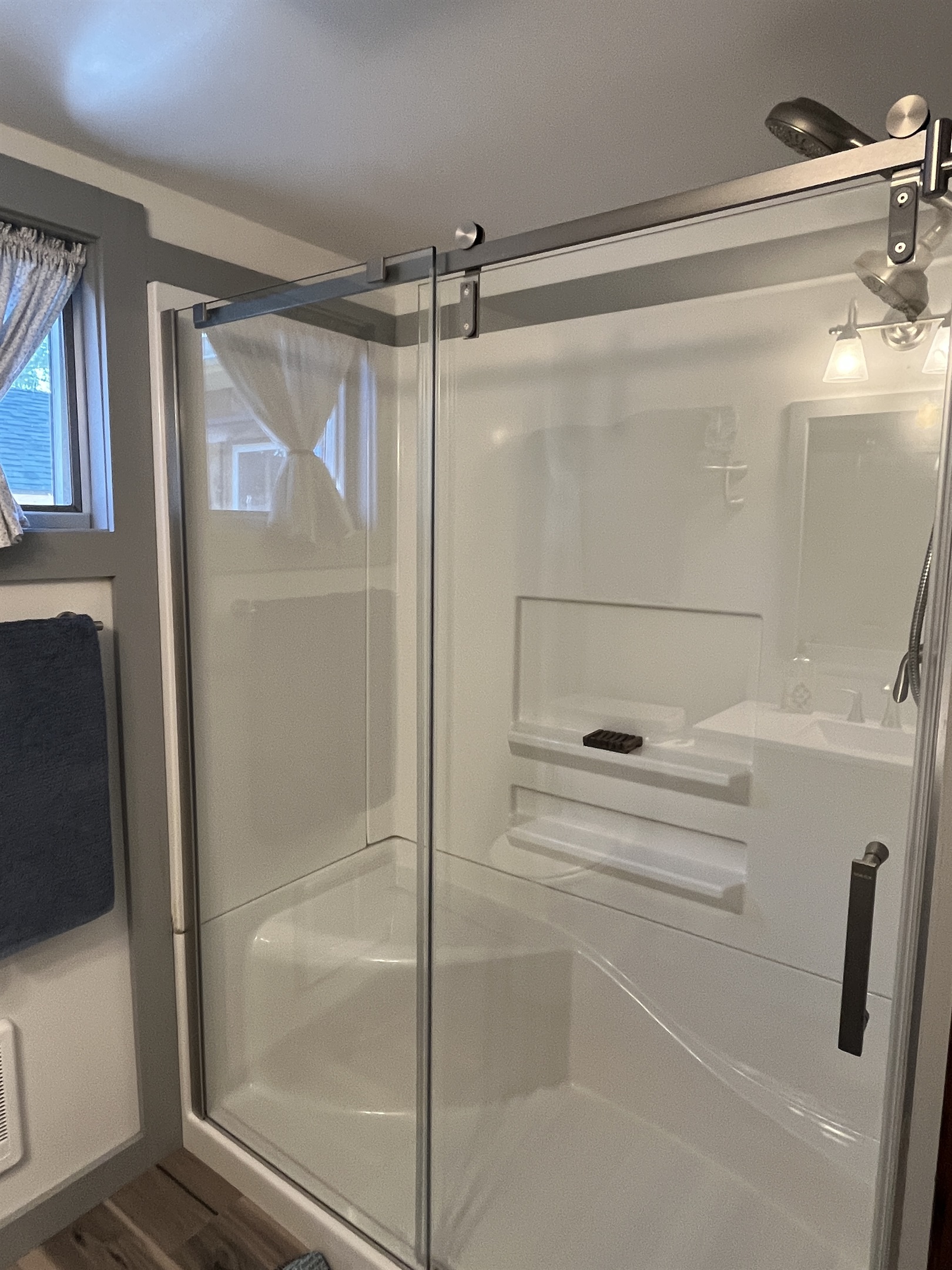 Recently renovated bathroom with shower
