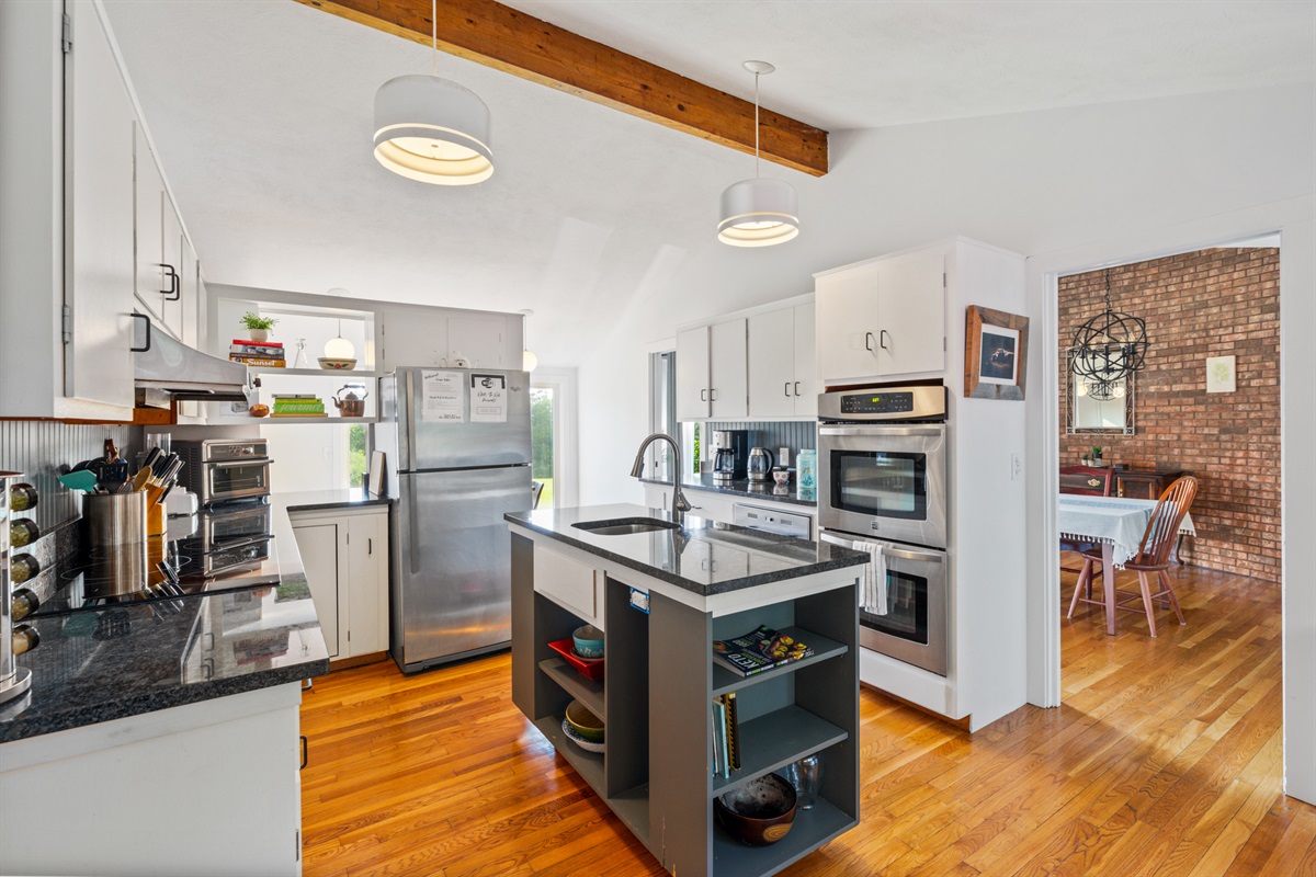 Kitchen with new granite counters, induction stove top including coffee and basic spices