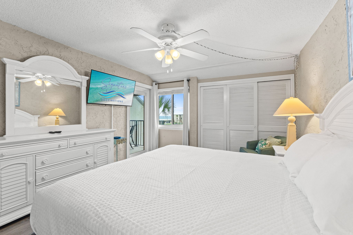 Master Bedroom with King Sized Bed, Ensuite Bathroom, and Balcony Access