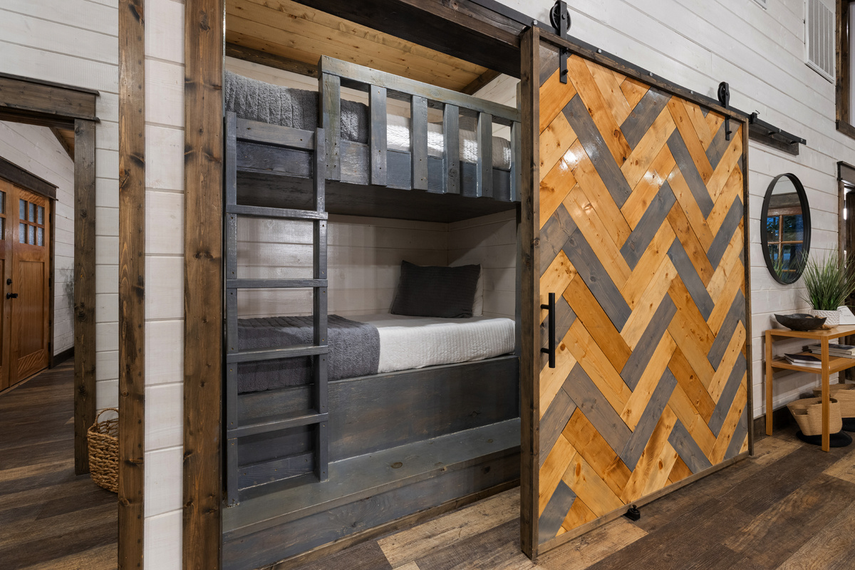 A little hideaway just for them. The twin bunk nook sits behind its own barn door and has been a favorite with families.