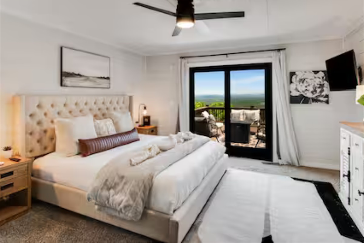 Waking up in this Luxurious master suite with private balcony access and stunning mountain views.