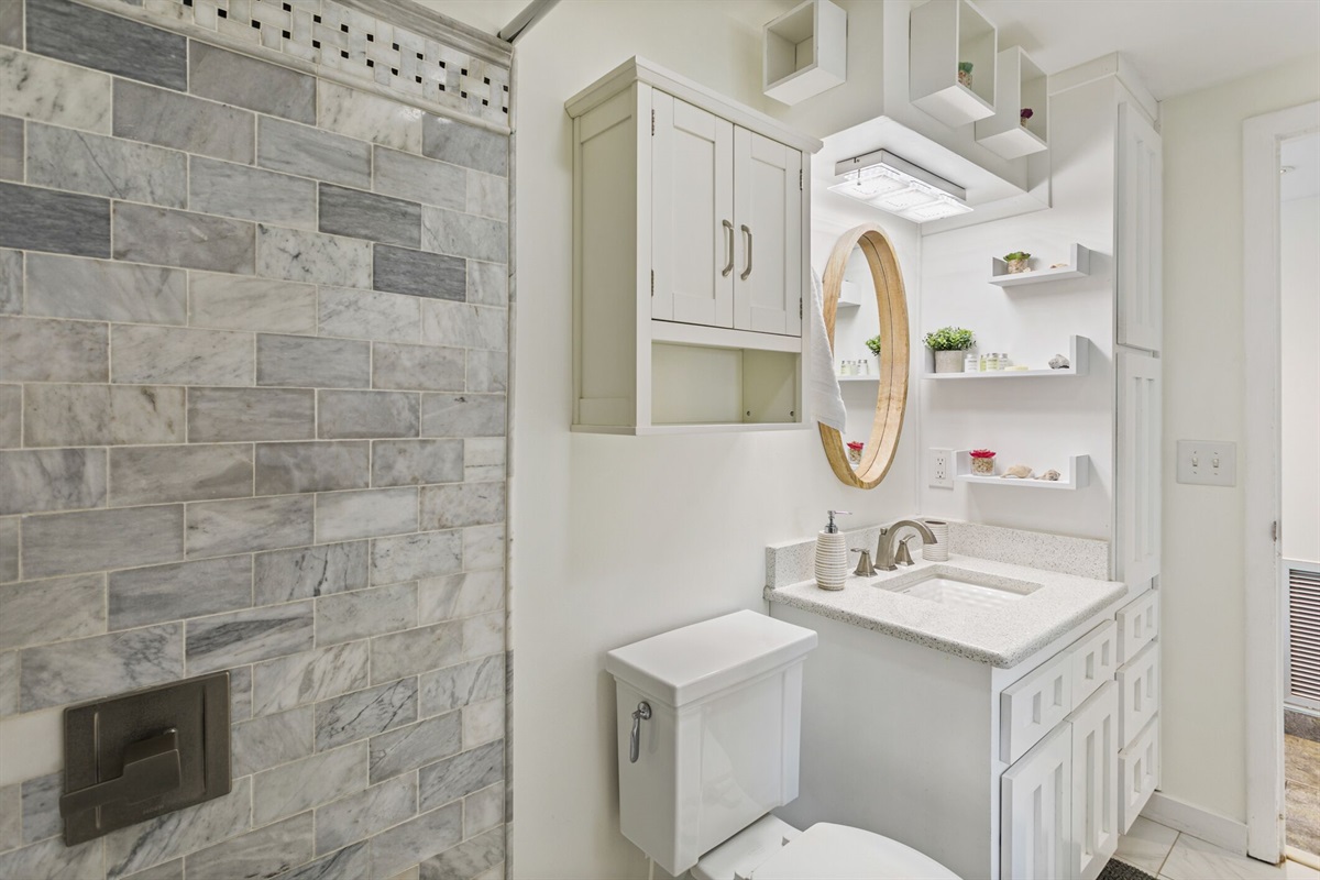 Bathroom: Marble tile shower, granite counter top, and jetted Jacuzzi tub