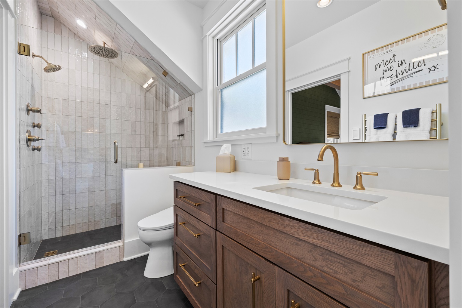 Spa-like shower with rain head, standard head, and body sprays. Oh, and the toilet has a bidet!