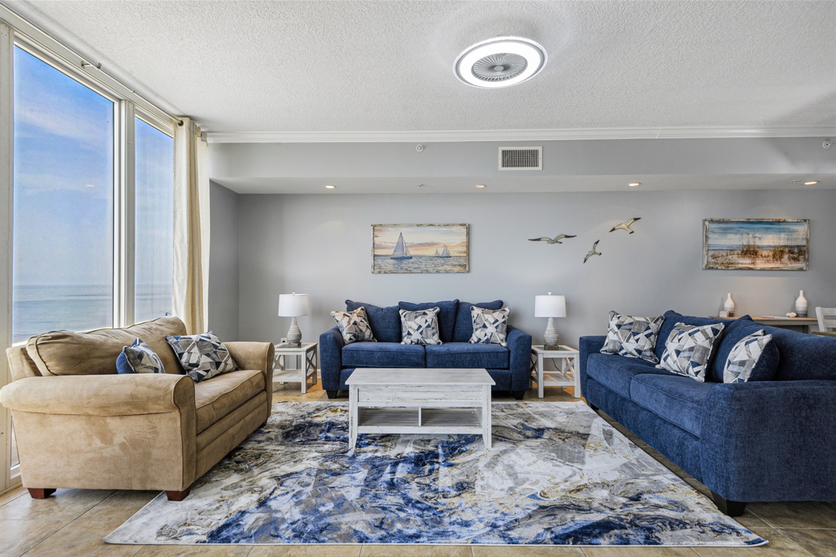 Living room. Tan love seat is a sleeper. Big screen tv not pictured.