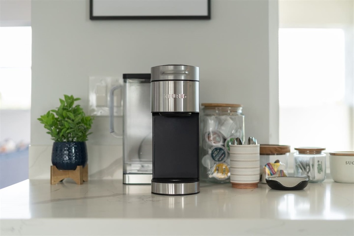 This delightful kitchenette is perfect for gathering, with cozy seating, dedicated coffee machines, a wine cooler, and a blitz arcade game to keep the fun going.