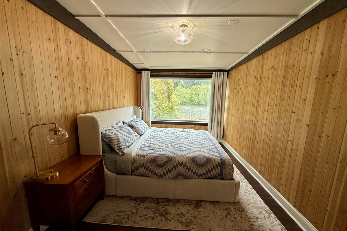 The king bedroom is your luxurious home base — spacious, comfortable, and perfectly positioned to wake up, stretch out, and head straight to the deck for that first coffee with a river view.