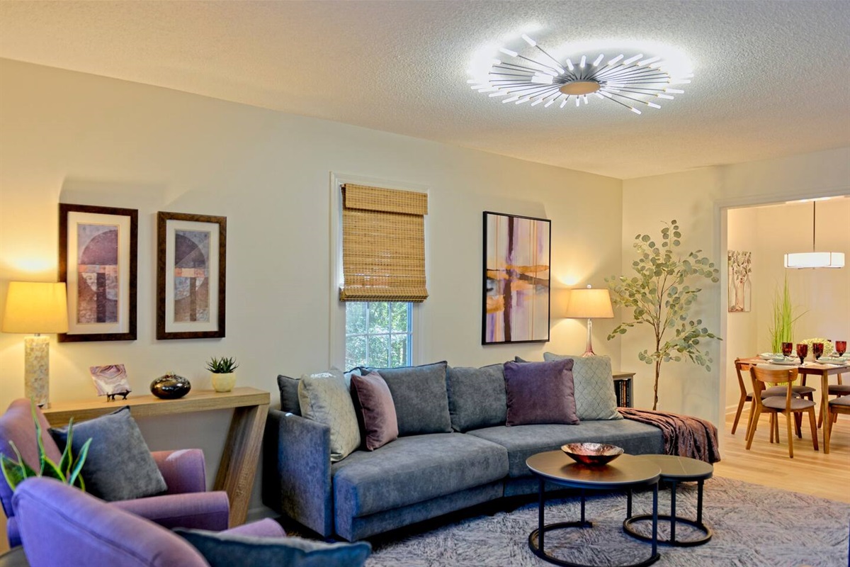 As you enter the home, you are greeted by the beautifully decorated living room with plenty of seating.