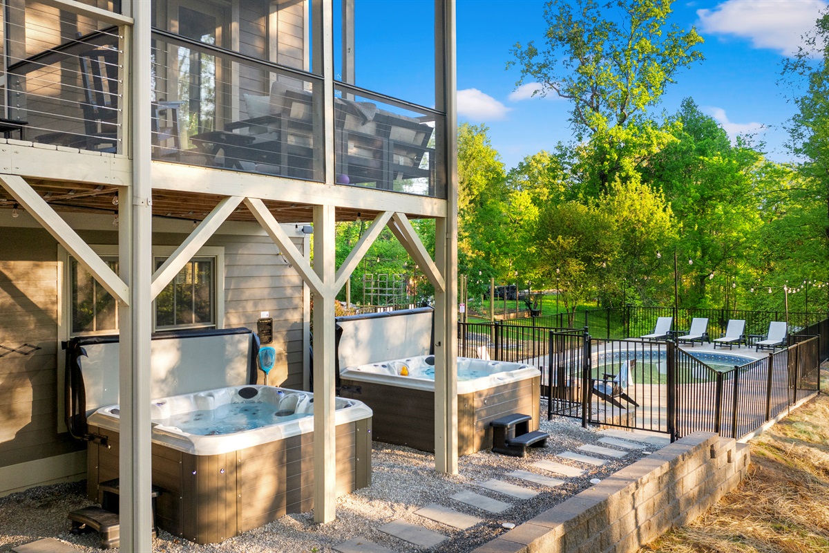 Your group will enjoy fun nights soaking in two private hot tubs overlooking the forest with seasonal mountain views. At night, enjoy the glow of party lights or stargaze under the open sky — pure Asheville magic.