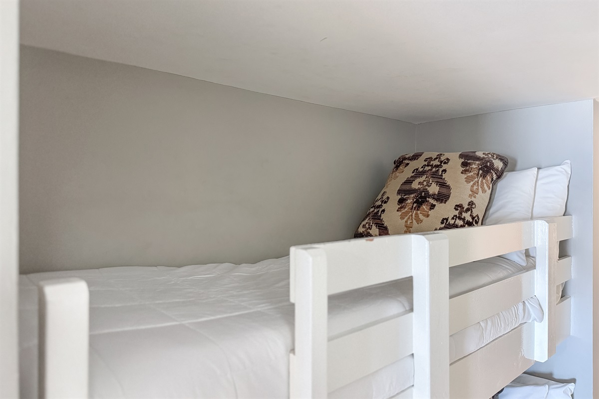 Perfect for the little ones or extra guests! This cozy hallway bunk area provides a fun and functional space for everyone in your group to get a good night's sleep.