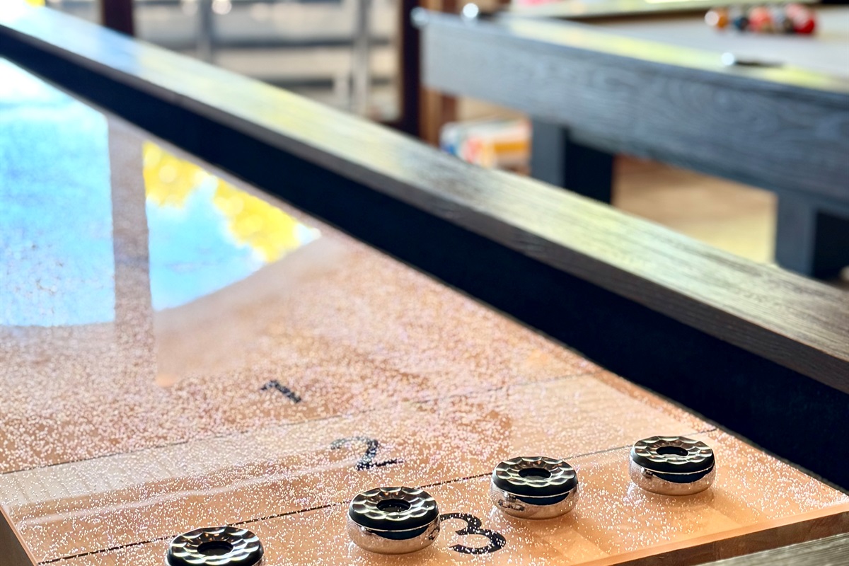 Shuffleboard has bowling pins as well as weighted pucks. 