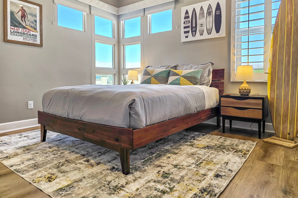 Bedroom #3 features a queen-sized bed, lake views, ceiling fan, smart TV, closet and an ensuite bathroom with walk-in shower. (Sleeps 2)